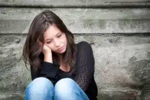 downcast woman suffering from addiction